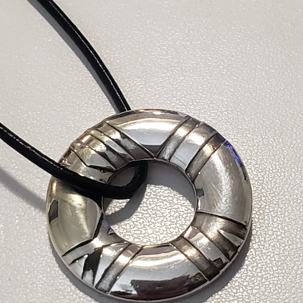 TIFFANY & CO "Atlas pendent" retired